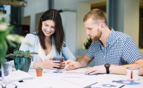 man-woman-working-diagrams-together